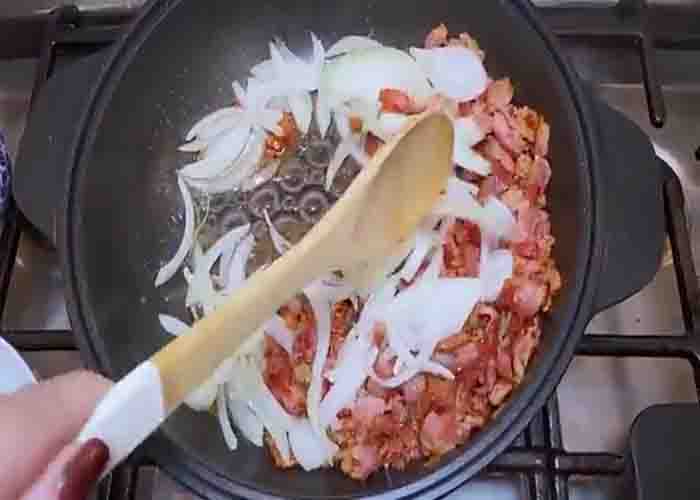Sauteing the bacon and onion for the hot honey cabbage recipe