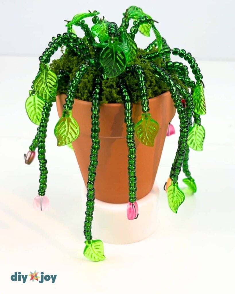 DIY wire plant made from colorful beads – a trendy handmade project that’s affordable and ideal for craft fairs or online sales