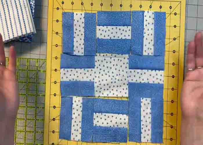 Laying out the fabric units to make the beggars quilt block