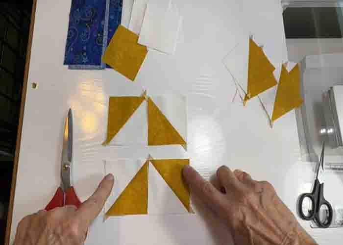 Making the half-square triangles for the downtown quilt block