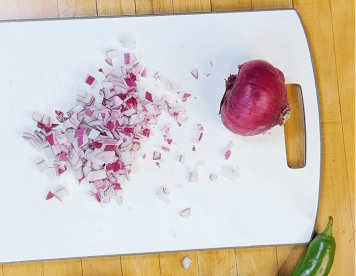How to Make Pomegranate Salsa - Chop Red Onion, Dicing it Finely