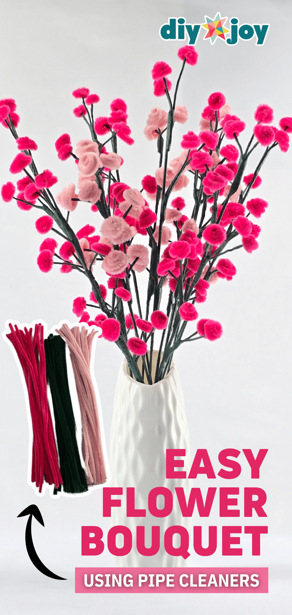 Easy pipe cleaner flowers, sprigs of tiny pink and red coiled pipe cleaner blooms on dark stems in a white textured vase