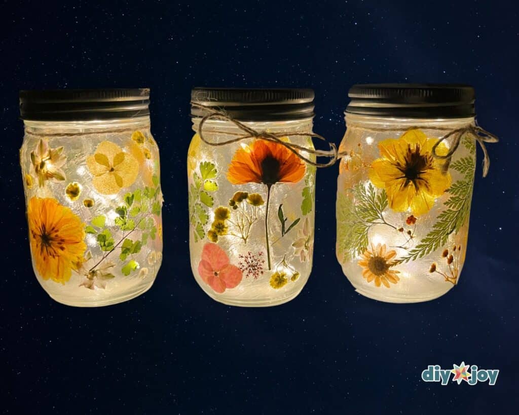 Glass jar filled with LED fairy lights and pressed flowers – beautiful money-making craft for Etsy or markets