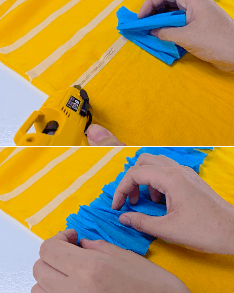 Easy Costume Ideas - top panel shows a yellow glue gun laying hot glue along a masking tape line on the shirt with a gathered blue crepe strip held above it, bottom panel shows two hands pressing and fluffing that fringe into standing ruffled rows
