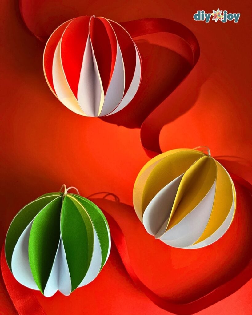 Honeycom christmas ornament in red, yellow, and green