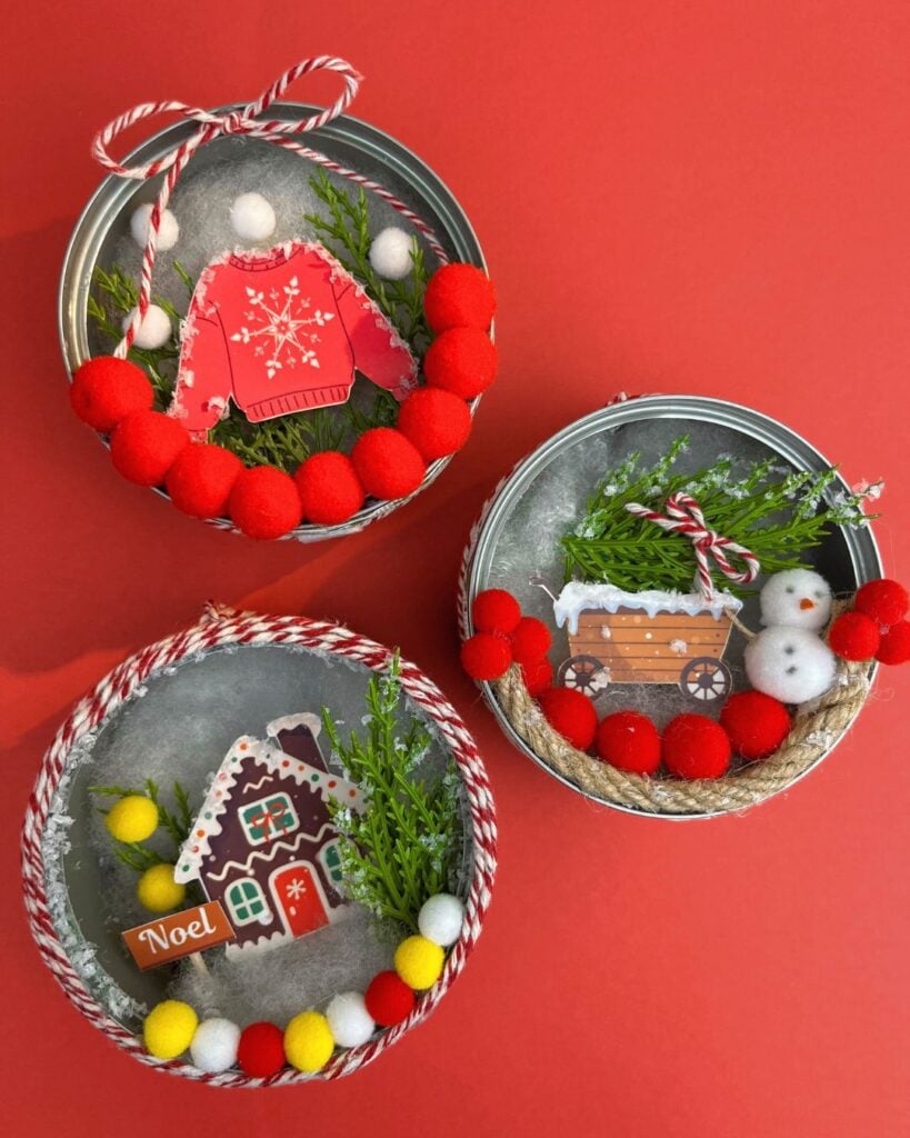 Three DIY tuna can Christmas ornaments with different designs: ugly sweater, christmas tree, ginger bread house