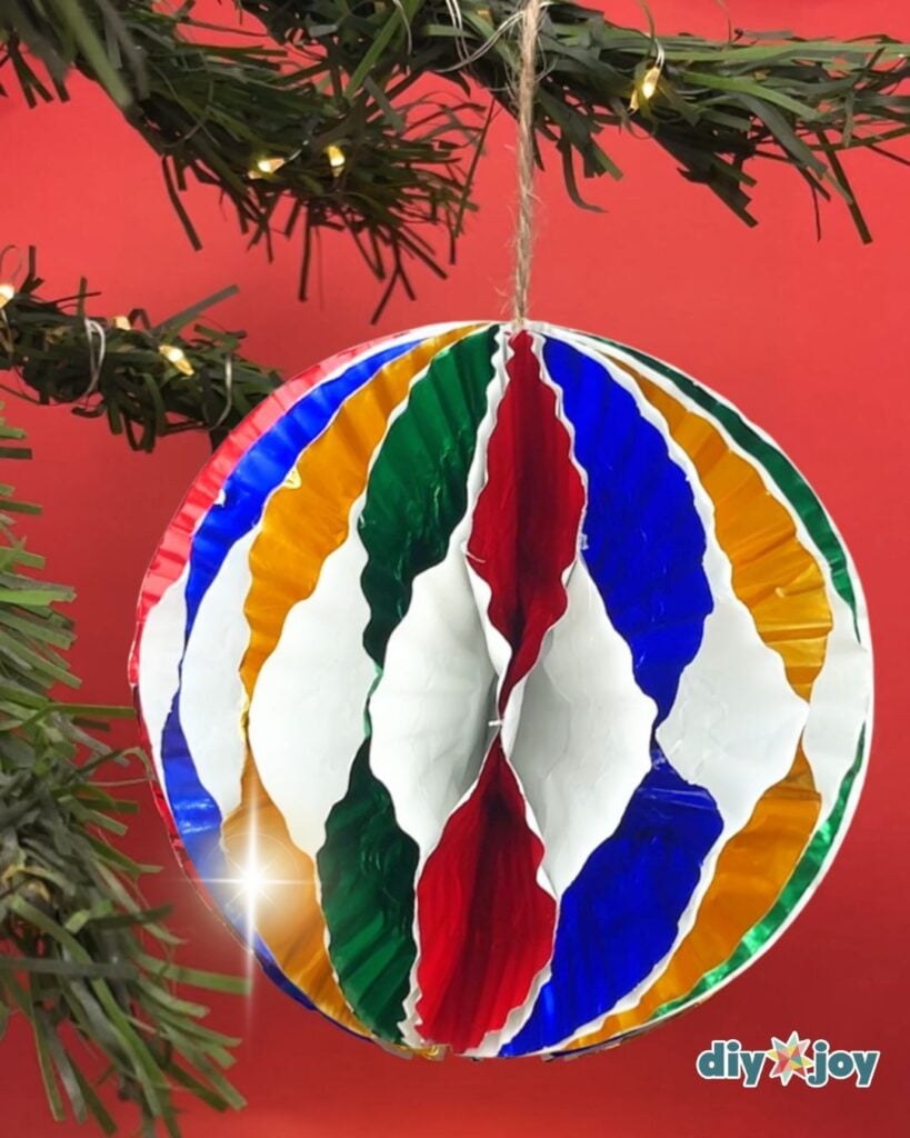 Cupcake Liner Christmas Ornament hanging on a christmas tree branch