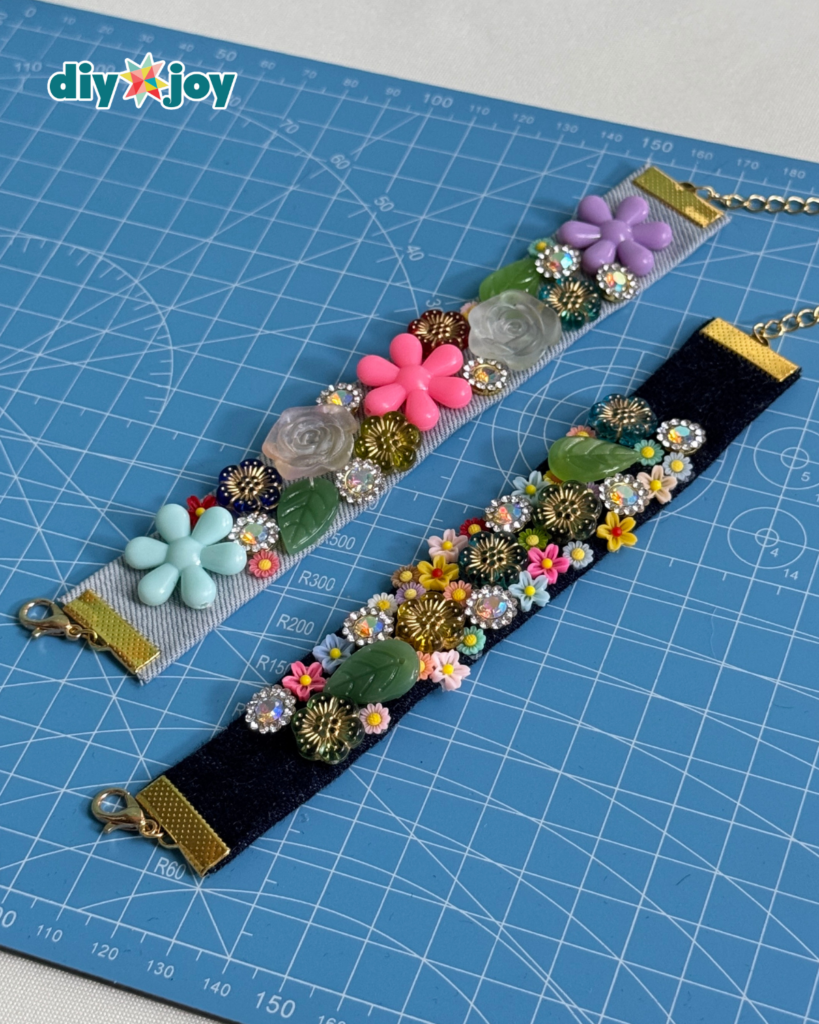 Handmade denim flower bracelet using upcycled jeans, assorted beads, buttons, and a metal clasp