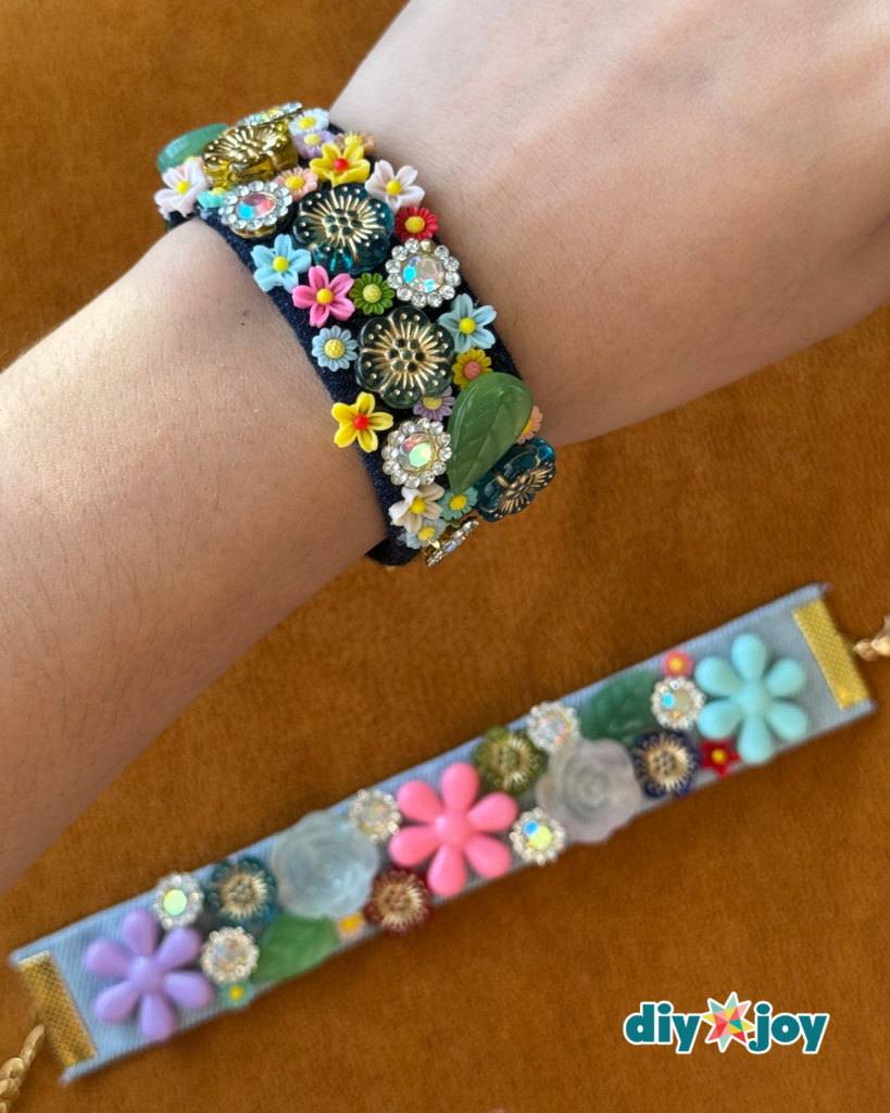 DIY denim flower bracelet made from old jeans, colorful buttons, beads, and recycled sewing supplies