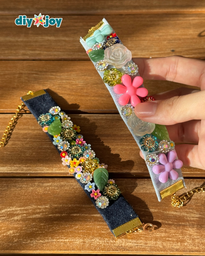 Upcycled denim craft showing an old pair of jeans cut into a bracelet strip for sewing