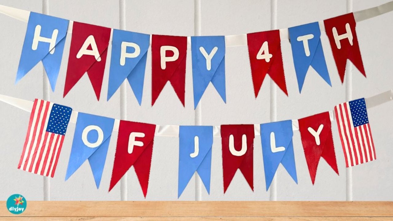 DIY 4th of July banner with toilet paper rolls, red and blue cardboard pennants spelling HAPPY 4TH OF JULY with flags