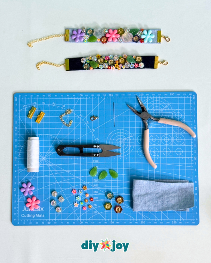 Colorful buttons and beads arranged on denim fabric for a DIY flower bracelet tutorial