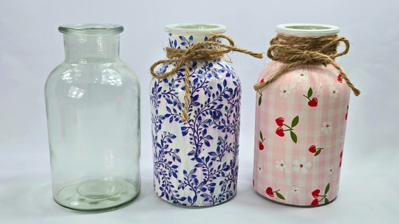 DIY decoupage vase, two jars covered in blue vine and pink cherry gingham napkin prints with twine bows by a plain jar