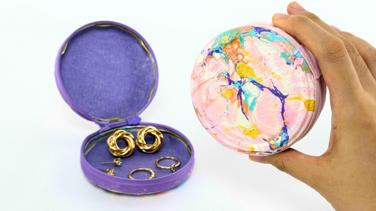 DIY Nail Polish Marbled Jewelry Purse DIY Nail Polish Marbled Jewelry Purse, Nail polish swirled on water and lifted onto a small hard-sided purse