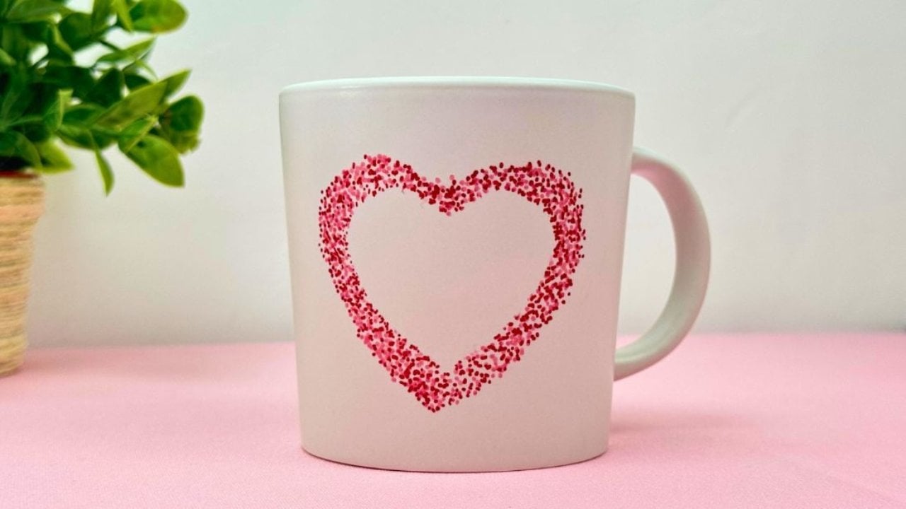 Sharpie heart mug made with a paper heart template and permanent marker, an easy personalized craft to make and sell