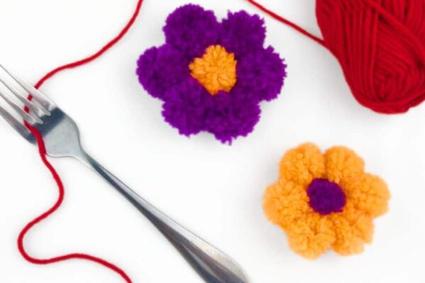 How to Make Pom Pom Flowers Using a Fork — easy step-by-step DIY tutorial.