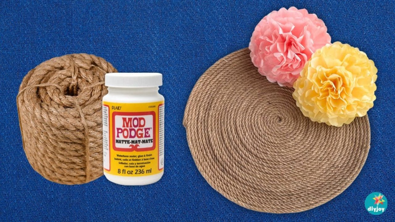 DIY Jute Rope Tray Made With Mod Podge Jute rope tray supplies flat lay on blue denim with a coil of rope, Mod Podge and the finished round tray