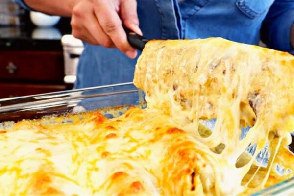 Baked Burritos Smothered w/ Creamy White Sauce, homemade and freshly served