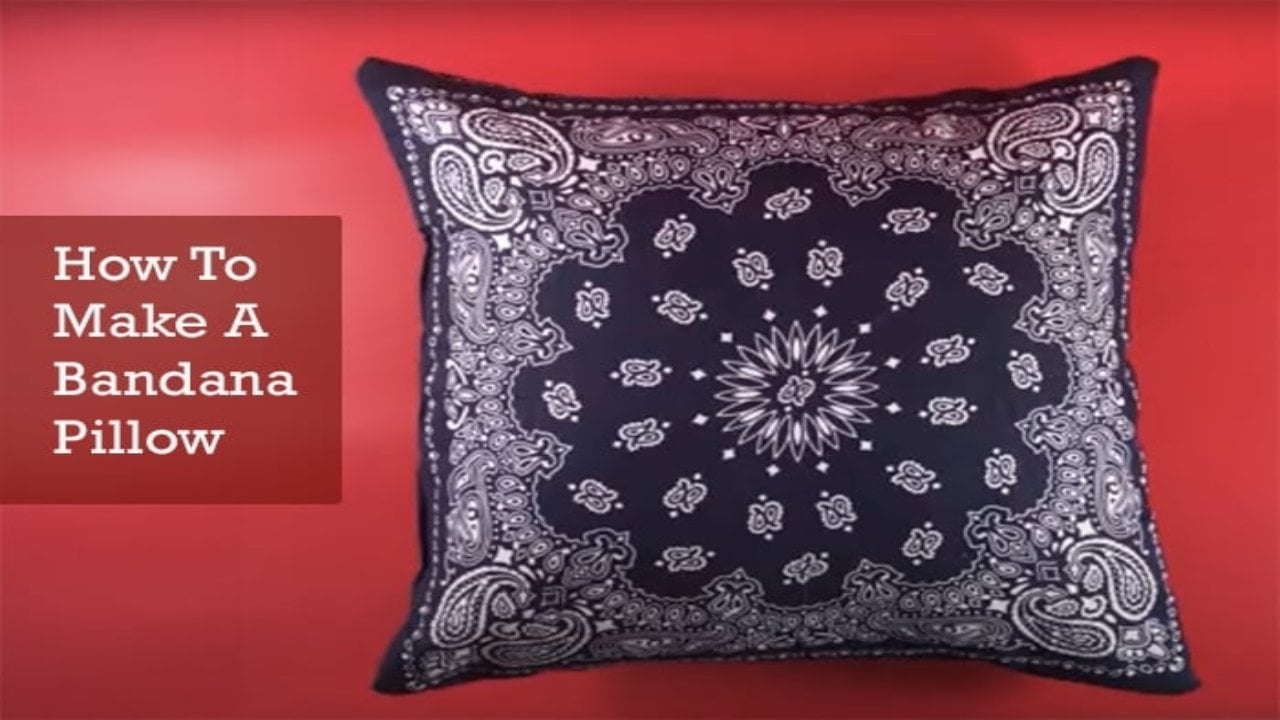 How to make a bandana pillow graphic showing one navy paisley bandana pillow cover on a bright red background