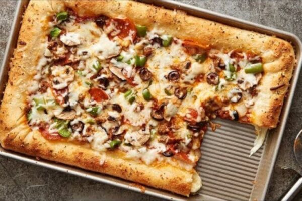 Cheese-Stuffed Sheet Pan Pizza, homemade and freshly served