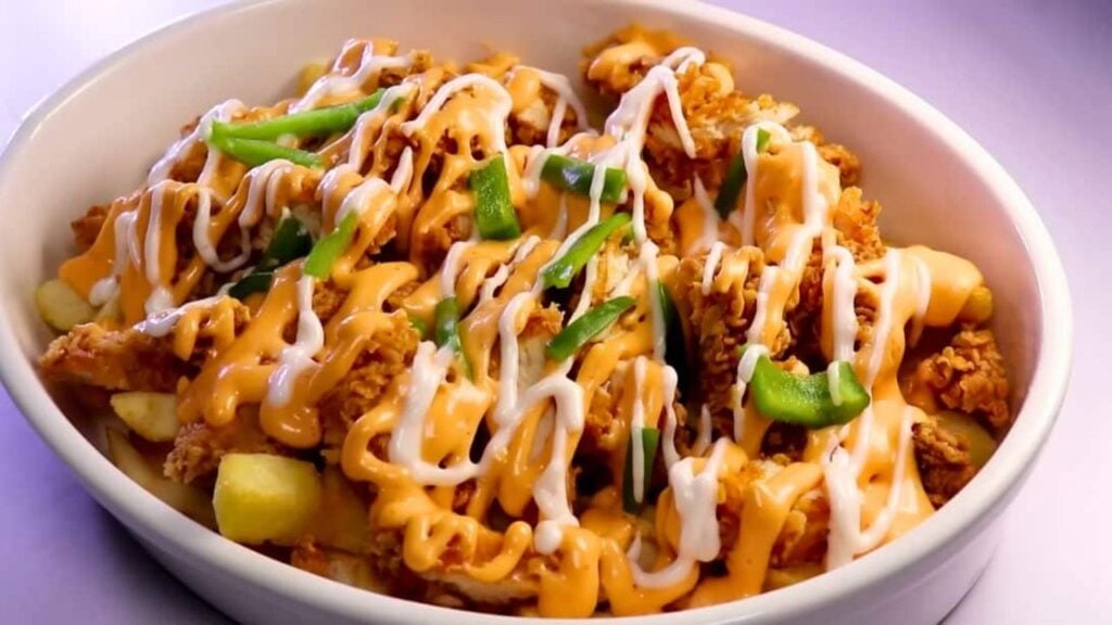 Chicken Loaded Fries With Cheese Sauce, homemade and freshly served
