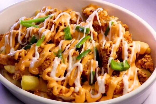 Chicken Loaded Fries With Cheese Sauce, homemade and freshly served