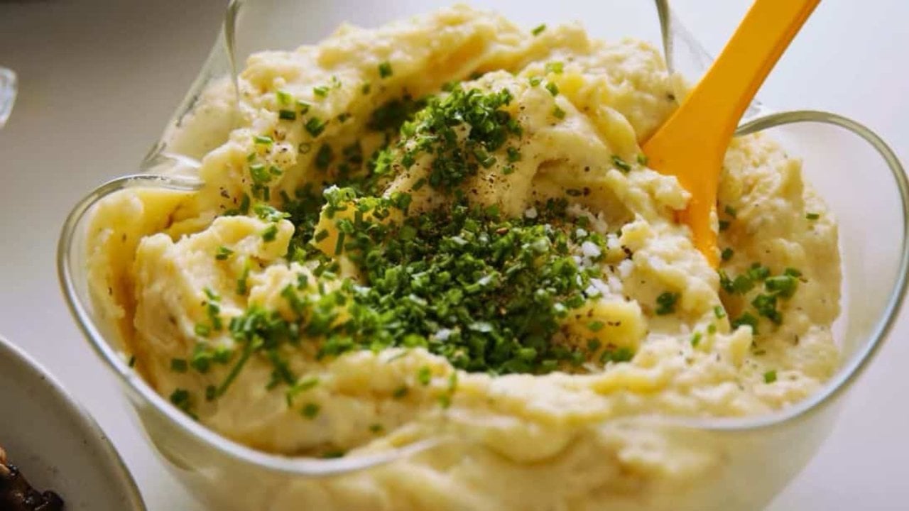 Creamy Buttermilk Mashed Potatoes Creamy buttermilk mashed potatoes in a bowl topped with butter, chopped chives and cracked black pepper
