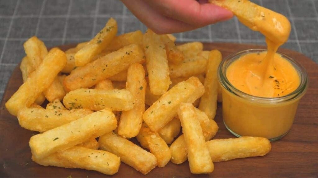 Crispy French Fries and Cheese Sauce, homemade and freshly served