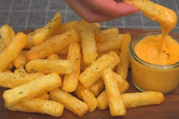 Crispy French Fries and Cheese Sauce, homemade and freshly served