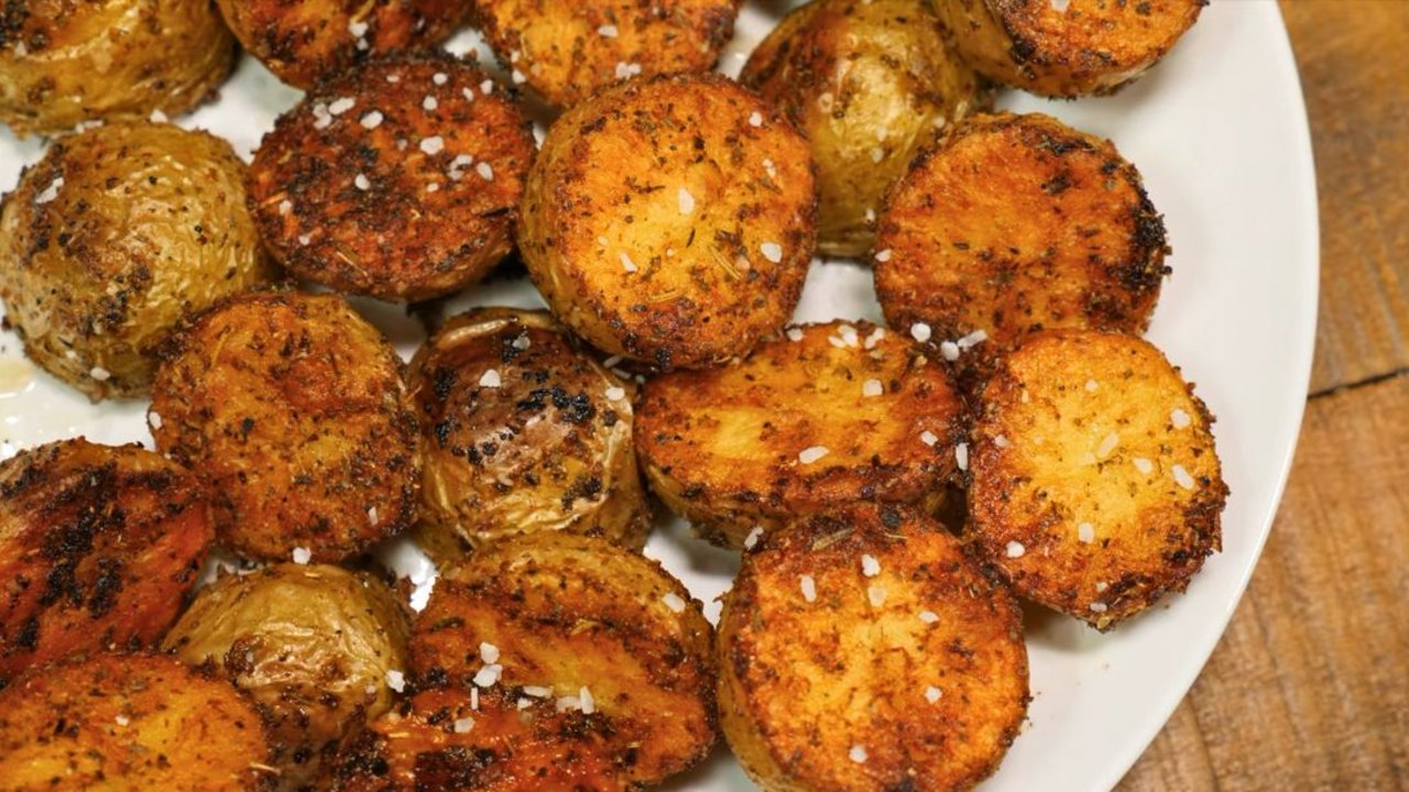 Crispy Oven Roasted Baby Potatoes Crispy oven roasted baby potatoes halved and browned with Italian seasoning on a foil lined sheet pan