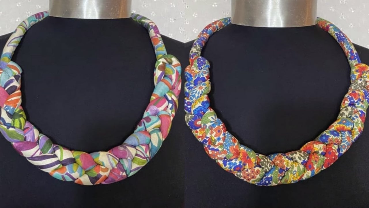 DIY fabric braided necklace, two thick braided rope necklaces in bright printed cotton shown on black display busts