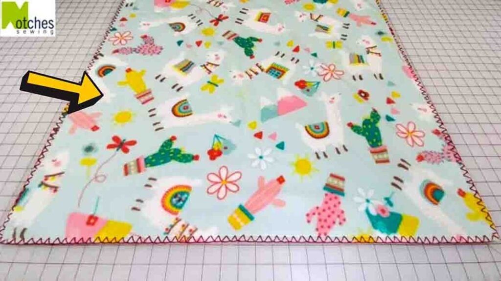 Finished DIY Fleece Blanket with Closed Blanket Stitch Edge, a completed DIY project