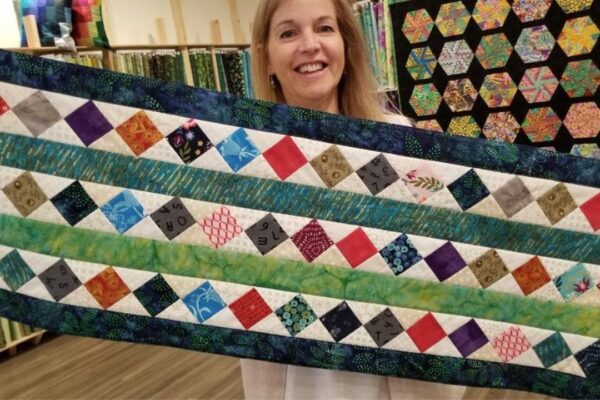 Finished Donna’s Scrap Buster Table Runner, a completed DIY project