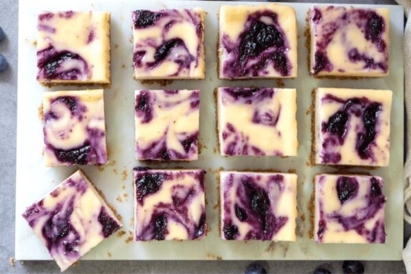 Easy Blueberry Swirl Cheesecake Bars, homemade and freshly served