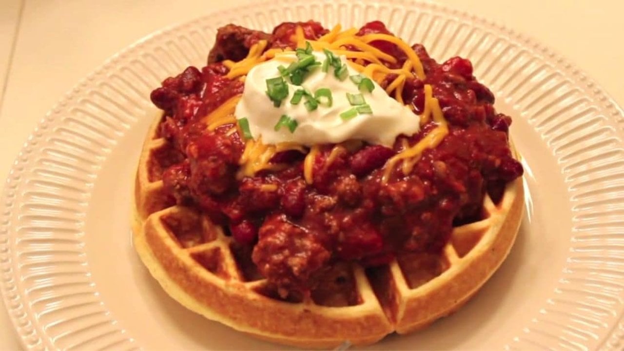 Easy Cornbread Waffle And Chili Recipe Cornbread waffle topped with beef and kidney bean chili, shredded cheese, cream cheese and green onion