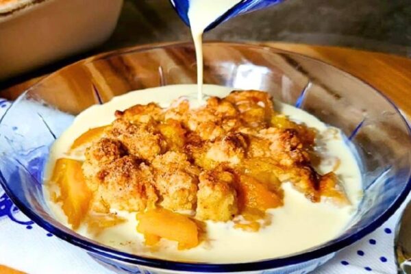 Easy-to-Make Crumbly Peaches and Cream Cobbler, homemade and freshly served