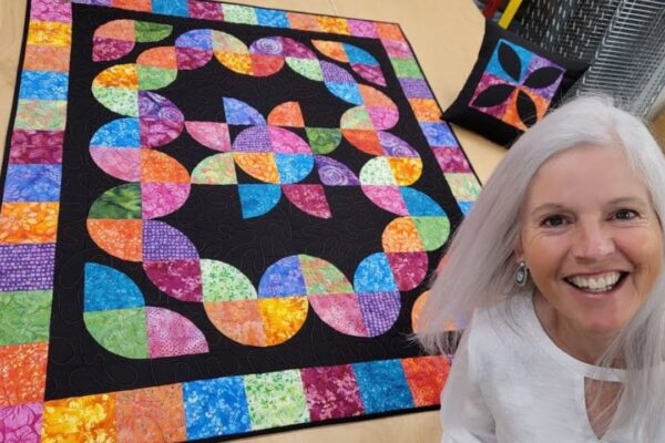 Finished Donna Jordan’s Drunkard’s Path Flower Patch Quilt, a completed DIY project