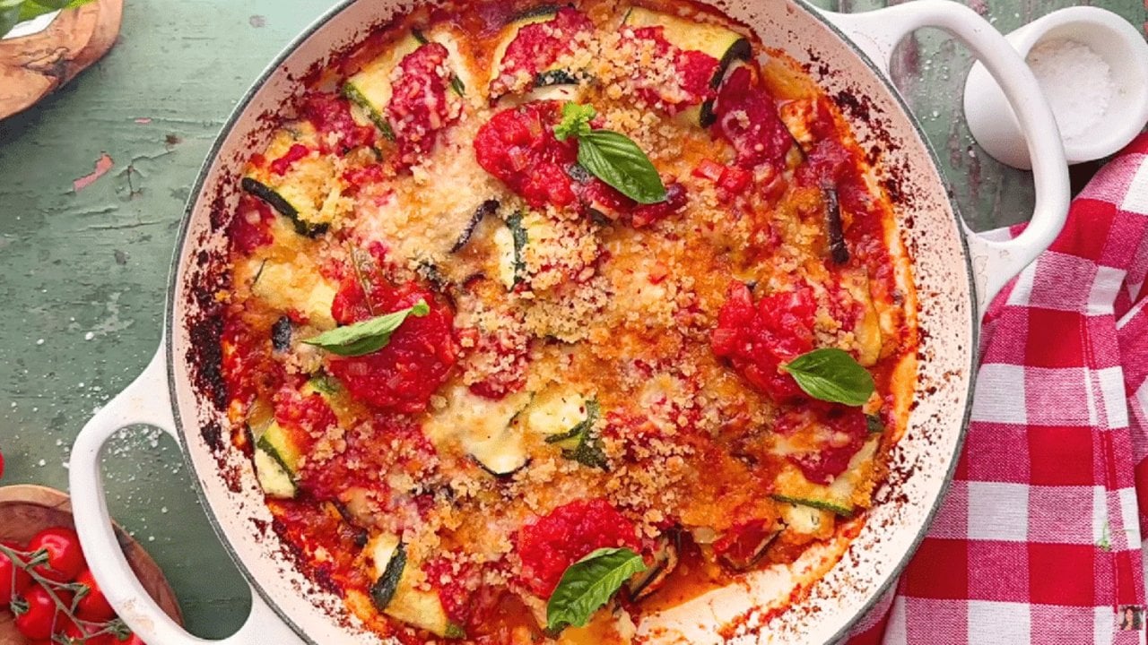 Eggplant and zucchini casserole rolls filled with ricotta and baked in marinara under melted cheese ready to serve at home