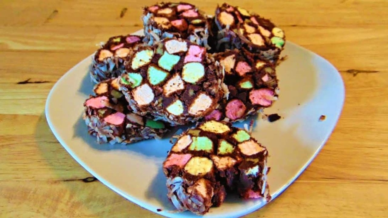 Easy No Bake Church Window Cookies No bake church window cookies, chocolate slices full of colored mini marshmallows on a pale blue plate