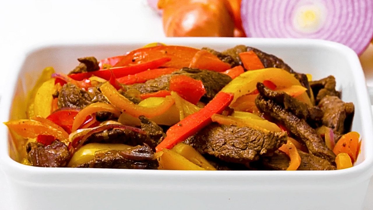 One pan steak and peppers with thin sliced flank steak, sweet onion and mixed bell peppers glazed in tamari