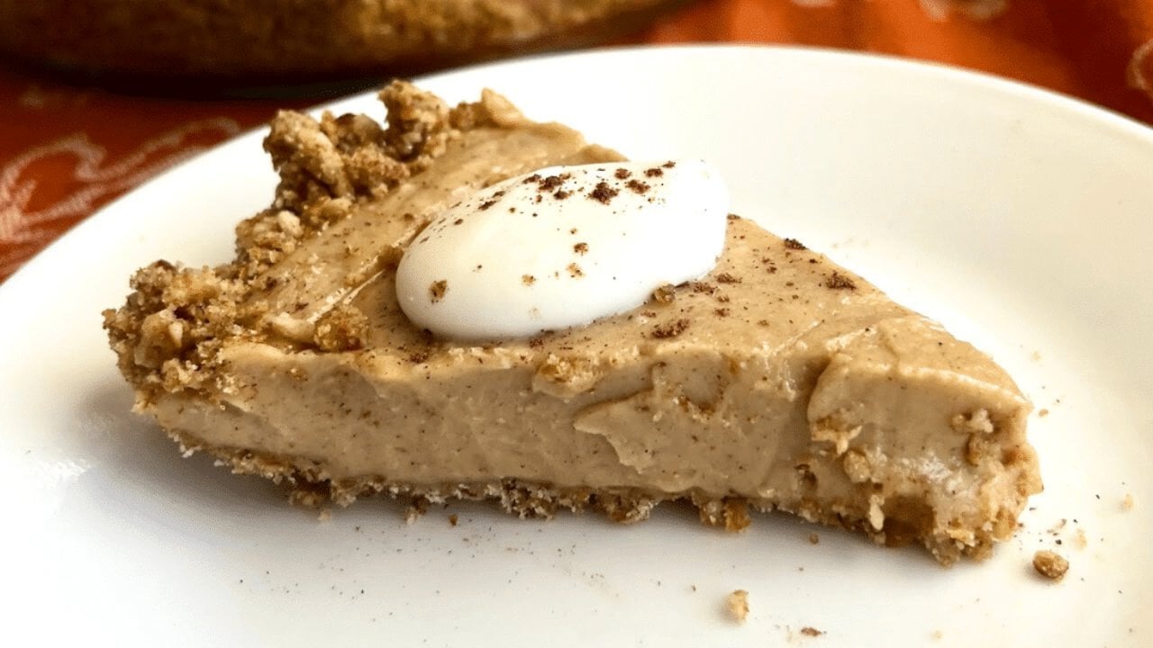 Peanut butter pumpkin spice pie with a crushed pretzel crust and a smooth spiced peanut butter filling