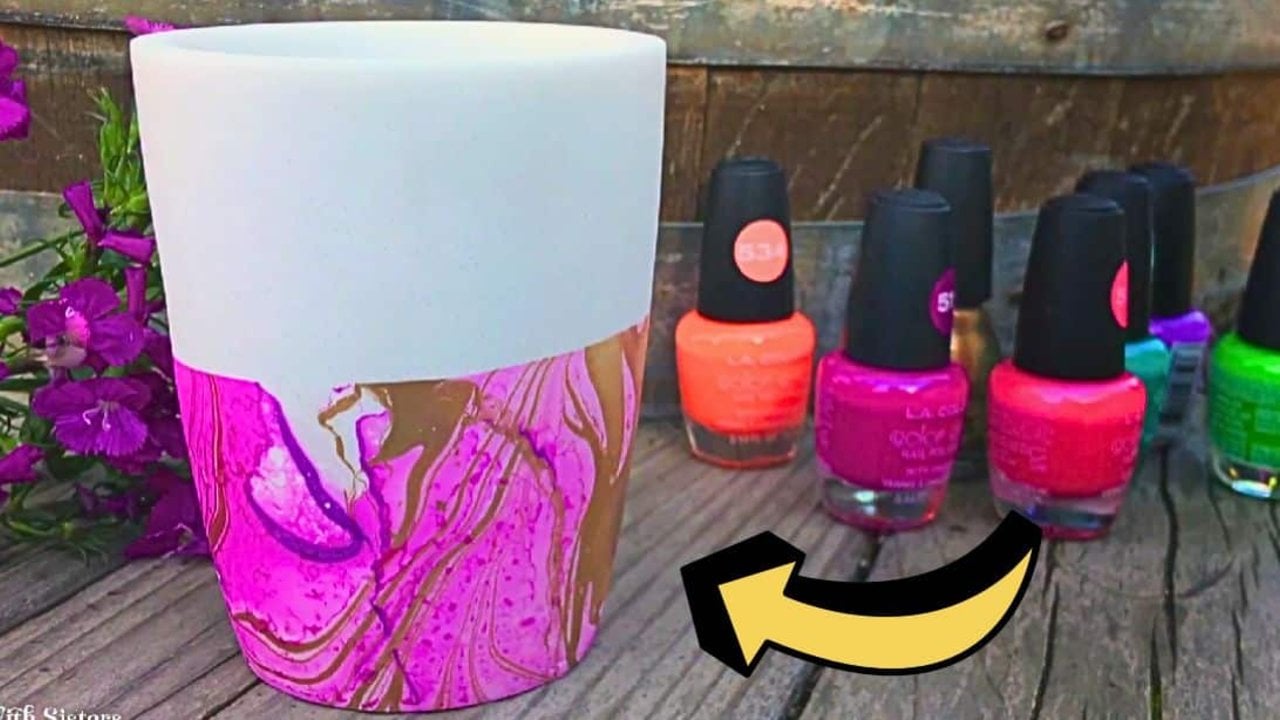 Marbled Nail Polish Flower Pot | Dipped Planter Marbled nail polish flower pot, a white pot dipped in hot pink and gold polish swirls beside bottles of neon nail polish