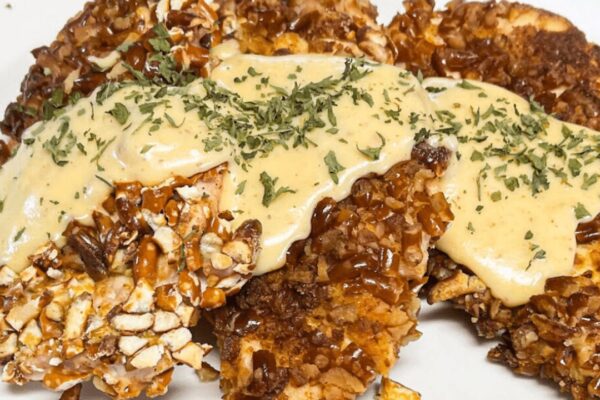 Easy Pretzel-Crusted Chicken with Cheese Sauce, homemade and freshly served