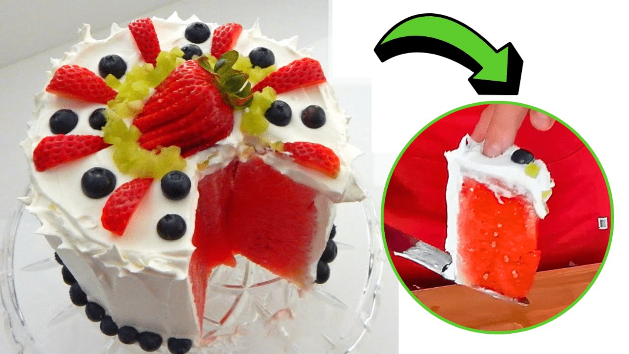 Easy No Bake Watermelon Cake Idea Watermelon cake frosted with whipped topping and topped with strawberries and blueberries on a glass stand