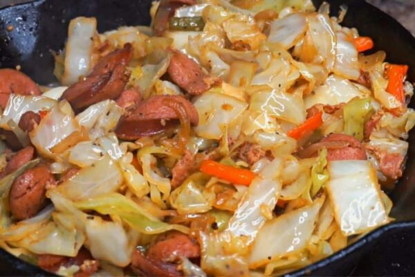 Simple Skillet Fried Cabbage With Bacon, Sausage, & Bell Peppers, homemade and freshly served
