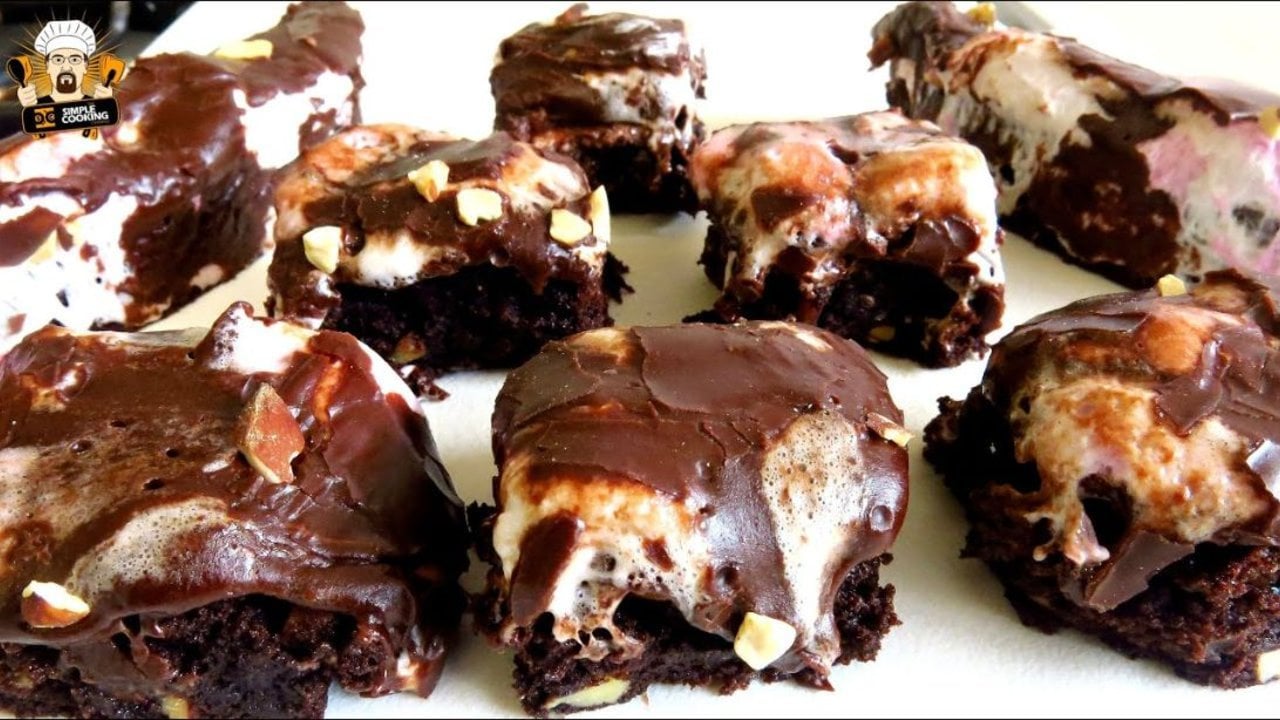 Mississippi Mud Brownies Recipe Mississippi mud brownies cut into squares with a melted marshmallow layer under a poured cocoa icing