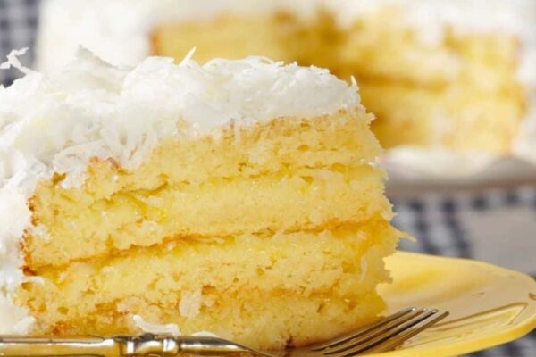 Moist and Fluffy Coconut Cake With Lemon Curd, homemade and freshly served