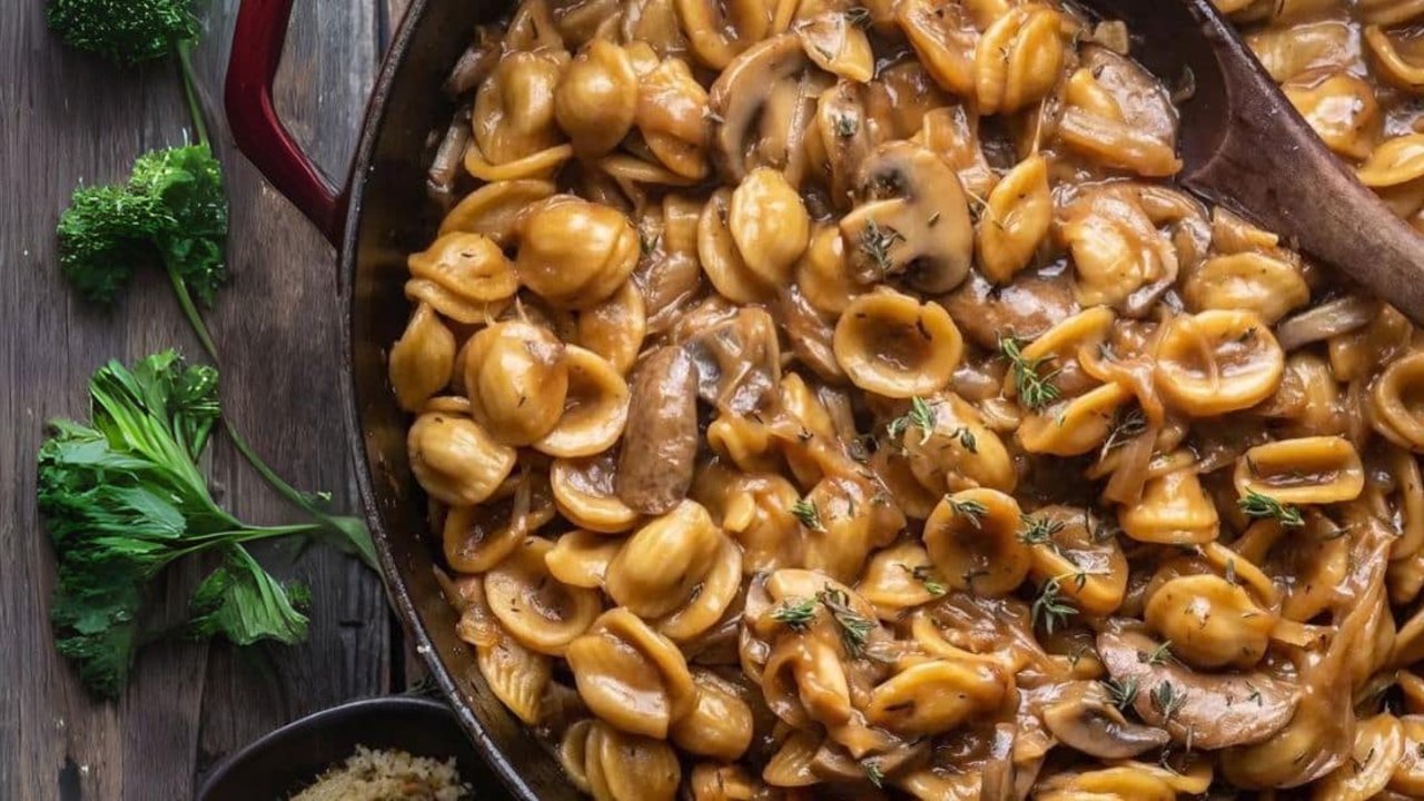 One-Pot French Onion Pasta Recipe One pot French onion pasta, orecchiette in a glossy caramelized onion and mushroom sauce with fresh thyme in a skillet