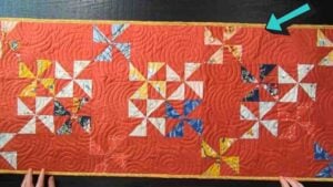 Finished Painterly Pinwheels Table Runner Quilt, a completed DIY project