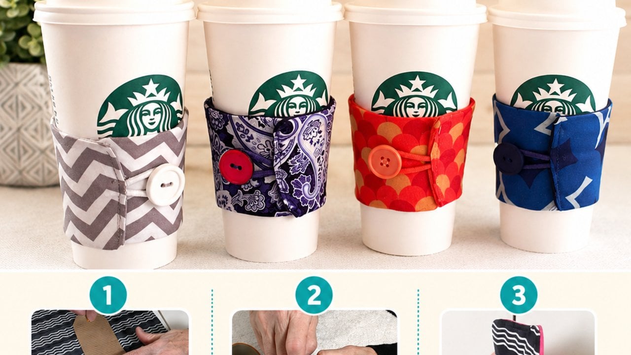 A printed cotton coffee cozy with batting inside and a snap closure, wrapped around a takeaway cup on a counter